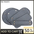 Черная кожаная сумка-слинг с заклепками и отверстиями