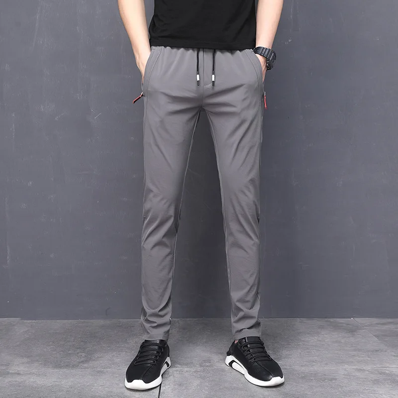 

Men's wear 2021 spring and summer quick drying men's casual pants Korean slim fitting and hemming fashion sportswear elastic