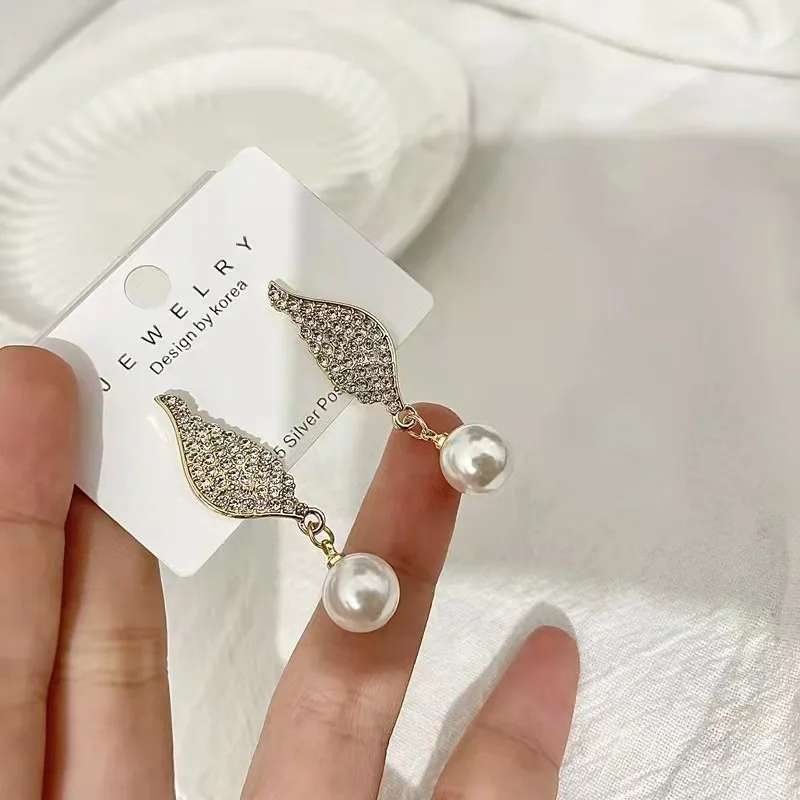 

S925 Silver Needle New Temperament Pearl Diamond Earrings Women's All-match Temperament Wind Wing Shape Earrings Trend