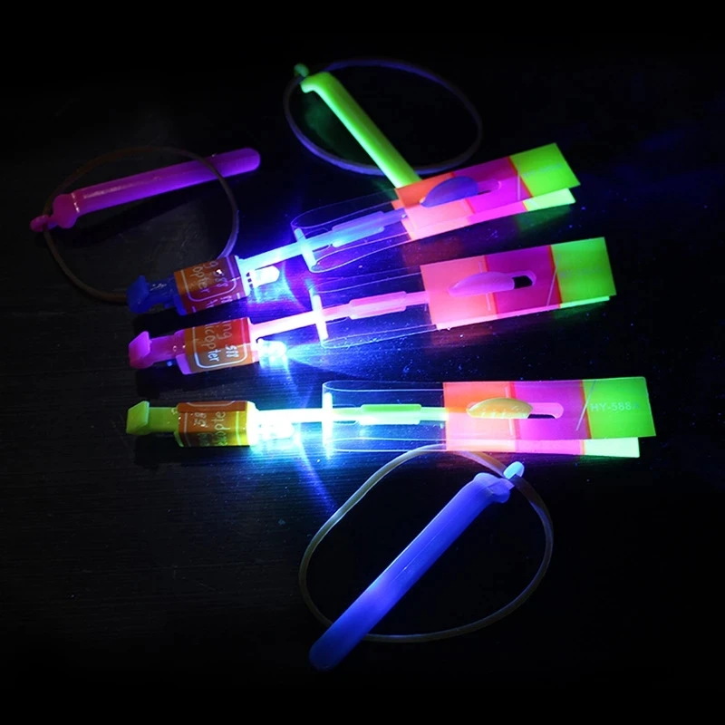

10Pcs/Set Outdoor Shining Rocket Flash LED Slingshot Elastic Helicopter Rotating Flying Toy Arrow Gift Children Fairy Catapult