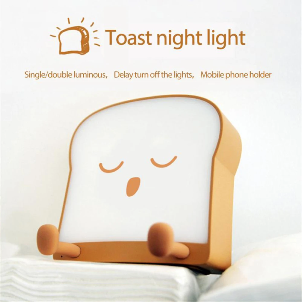 

New Novelty Toast Bread Night Light Usb Creative Cartoon Bedside Silicone Nightlight Mobile Phone Stand Bedroom Decoration Gift