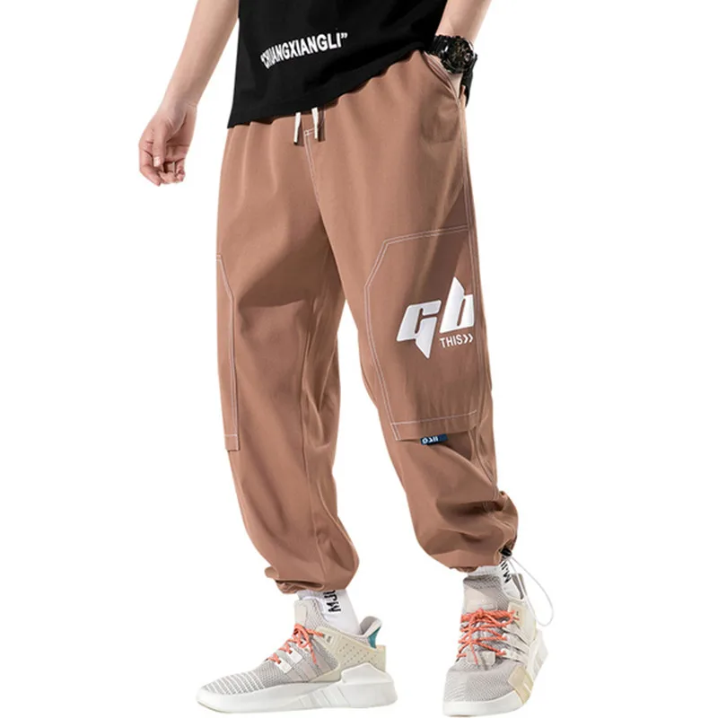 

Брюки мужские весенне-летние оранжевые с эластичным поясом и несколькими карманами