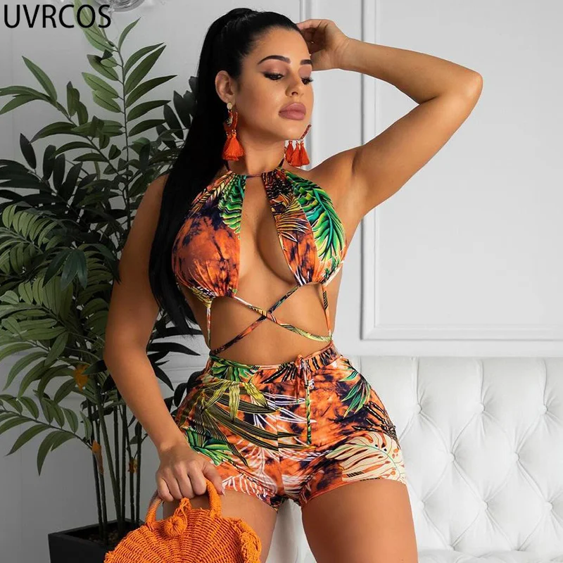 

UVRCOS Beach Leisure Vacation Rompers Womens Jumpsuit Summer 2021 New Fashion Printing Hollow Out Sexy Halter Bandage Playsuits