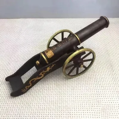 

Antique bronze ware with small bronze cannons