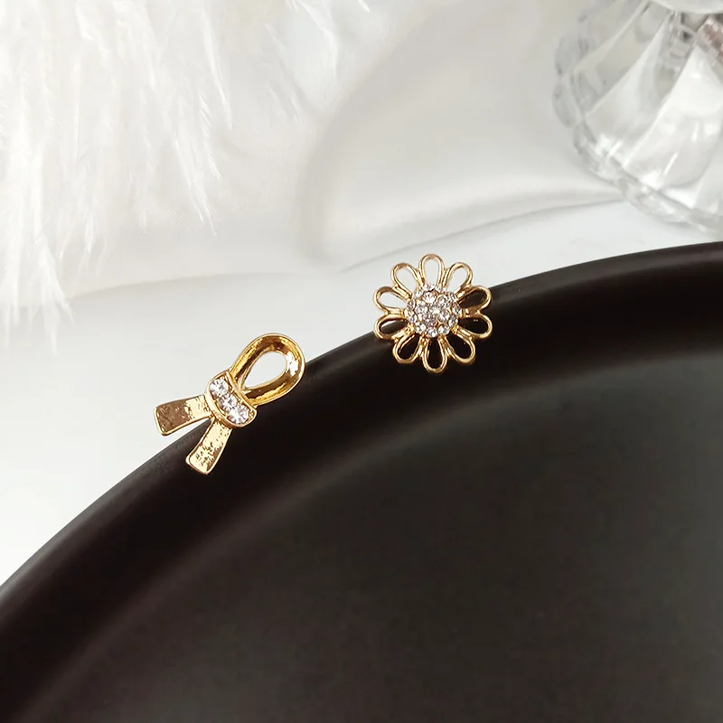 JNP43 S925 silver needle Korean bowknot small daisy simple ins tide niche brand asymmetrical earrings female