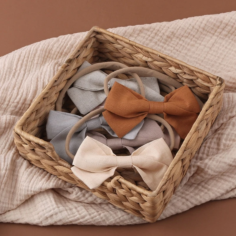 

Повязка на голову эластичная льняная с бантом для новорожденных