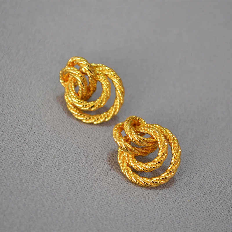 

European and American niche middle-aged wind twisted braided brass 925 silver needle earrings earrings female