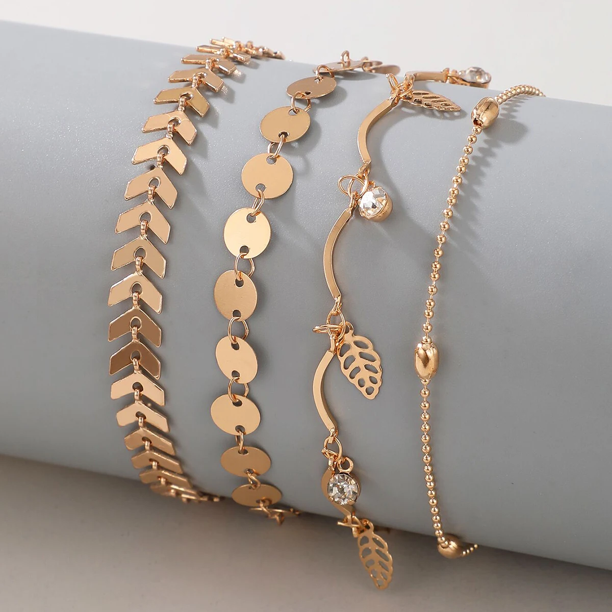 Docona 4pcs/set Роскошные кристальные браслеты на щиколотку с листьями дерева и кисточками для женщин, золотые геометрические полые металлические браслеты на щиколотку, набор ювелирных изделий 15619.