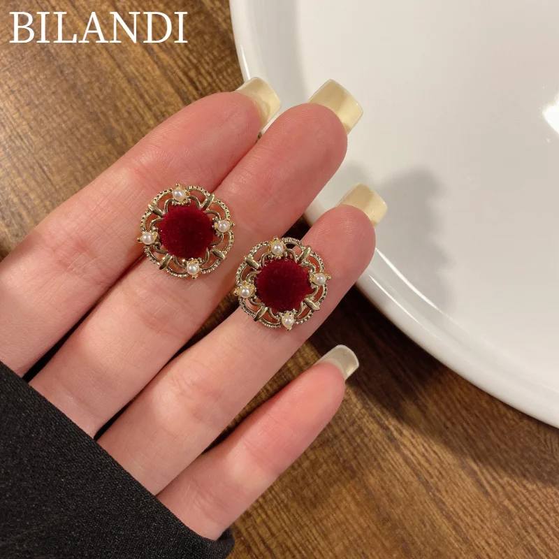 

Bilandi S925 needle Women Jewelry Flocking Earrings Delicate Design Vintage Hollow Metal Stud Earrings For Women Wholesale
