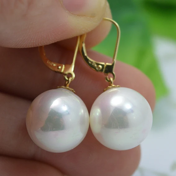 сплав жёлтого цвета 6 букв. круглые крупные серьги с белым. 14 жемчужина. одесса жк жемчужина. овальный жемчуг.