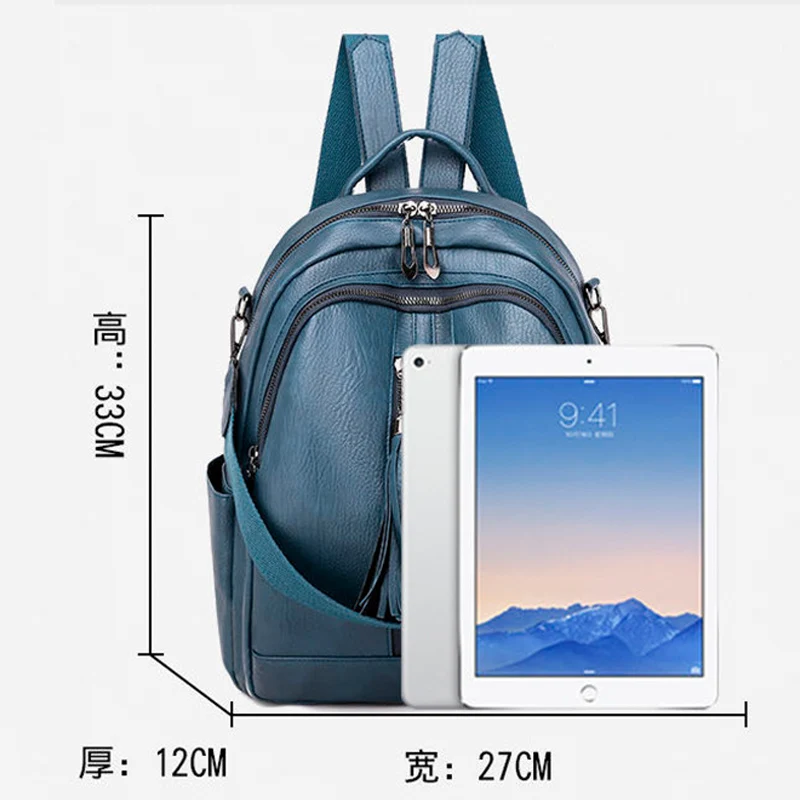 Женский рюкзак из мягкой искусственной кожи синий с небольшой кисточкой и