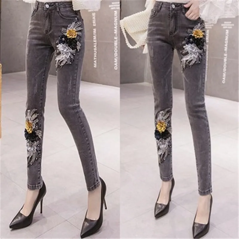 

Autumn and winter new products black jeans women beaded three-dimensional flower pants pants personality beaded pencil trousers