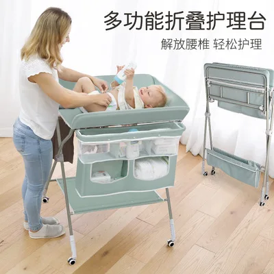 

New baby changing table BABY massage nursing table height adjustment nursing table with wheels can be implemented