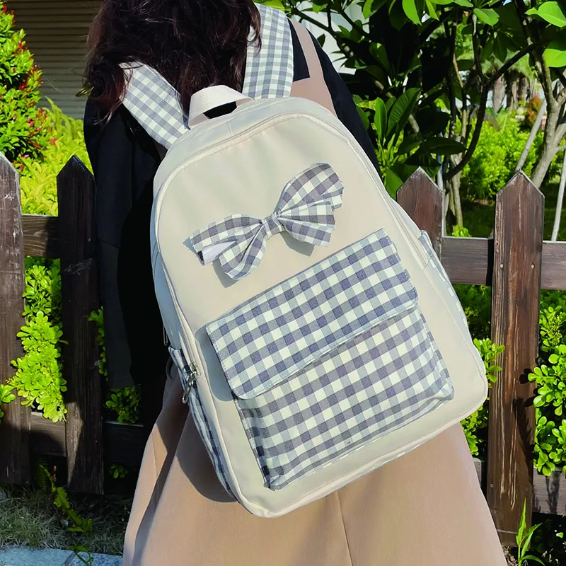 

Милый женский рюкзак в клетку для девочек, нейлоновый школьный ранец с бантом, Повседневная вместительная модная дамская сумка для книг с з...