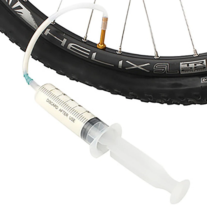

Bicycle Tubeless Tire Liquid Injection Tool MTB Road Bike Tubeless Sealant Injector UST Tyre No Inner Tubes Valve Core Tool 10cm