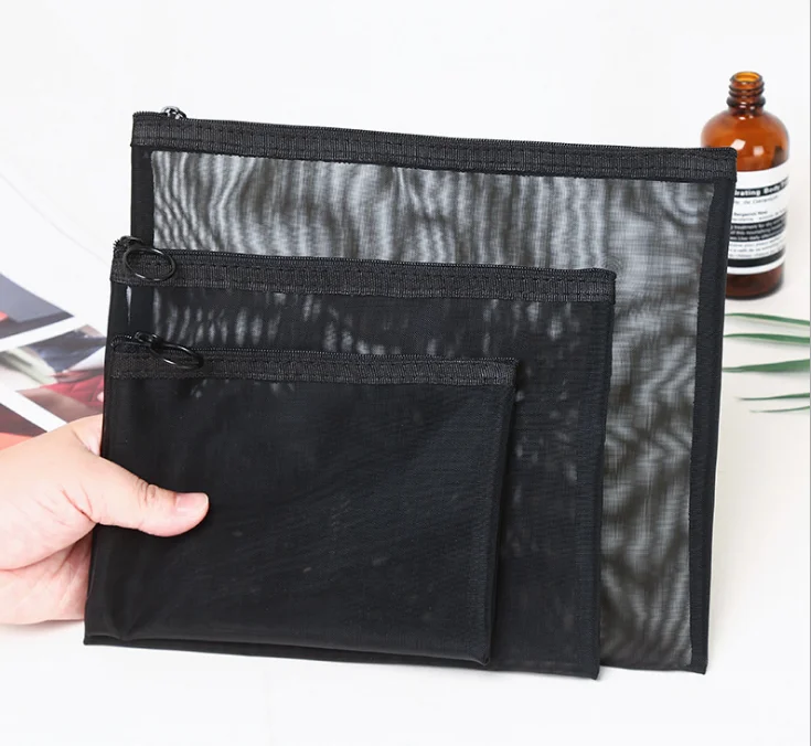 

Three-piece cosmetic bag in black transparent mesh