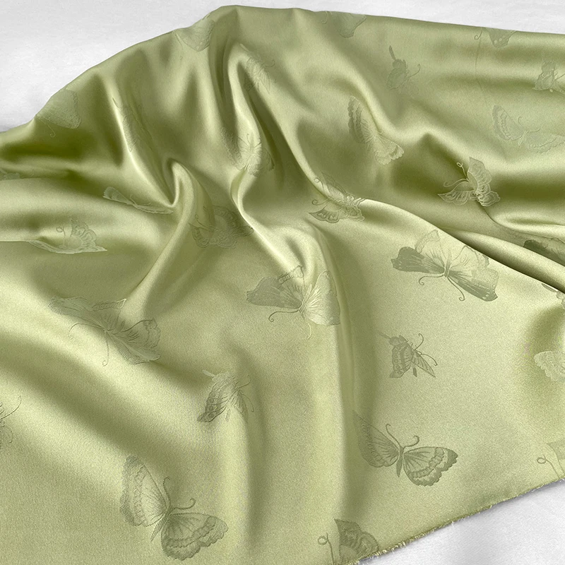 Imported elastic imitation silk satin tea green dark pattern butterfly luster jacquard fabric shirt Hanfu cheongsam fabric