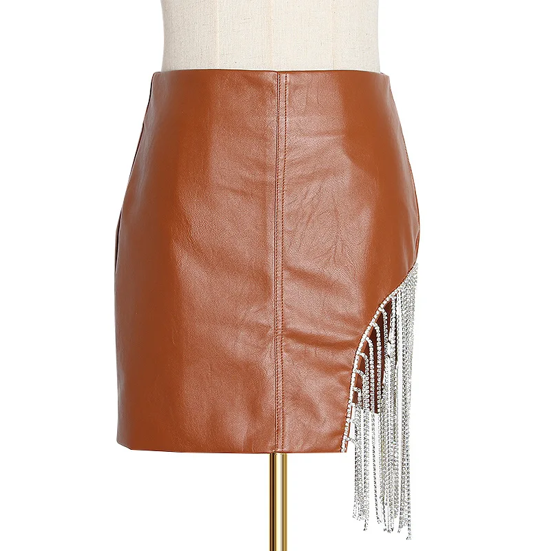 

Hot sale solid color pu leather skirt women summer irregular stitching tassel mini waist hip skirt