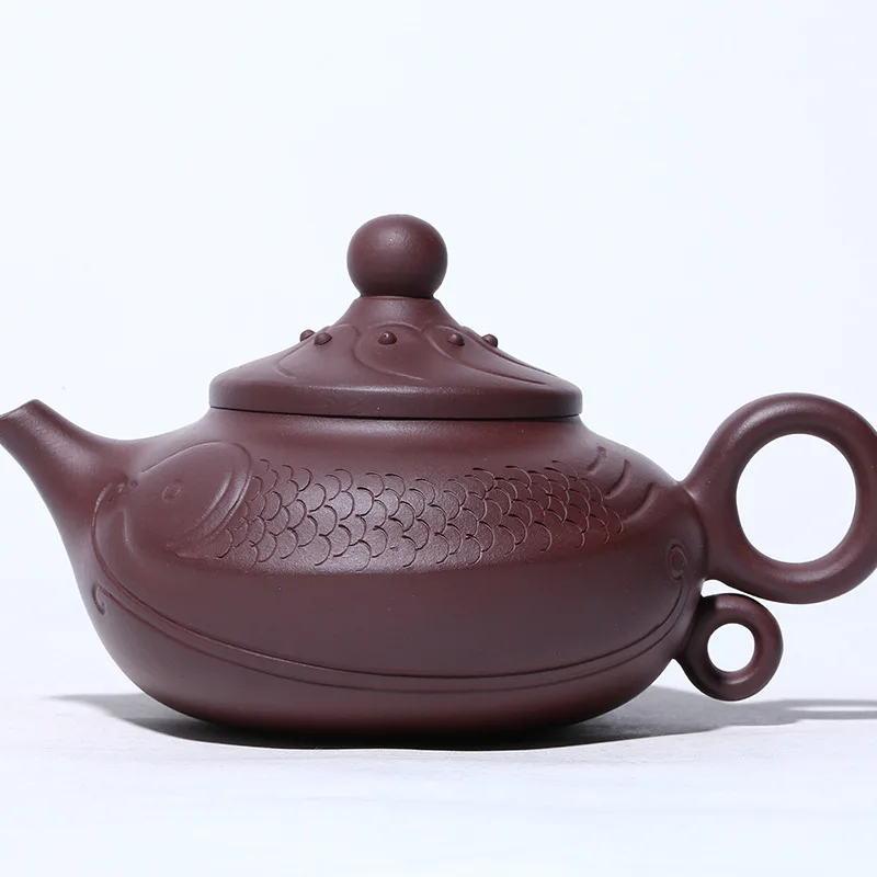 

Yixing Dark-red Enameled Pottery Teapot Raw Ore Purple Mud Pisces Playing With Beads Dark-red Enameled Pottery Teapot Suit Tea