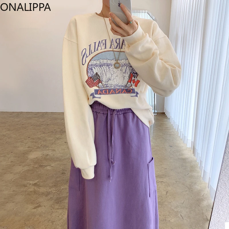 

Женский комплект ONALIPPA в японском колледжском стиле, свитер с круглым вырезом и мультипликационным принтом, юбка-трапеция с двумя карманами ...