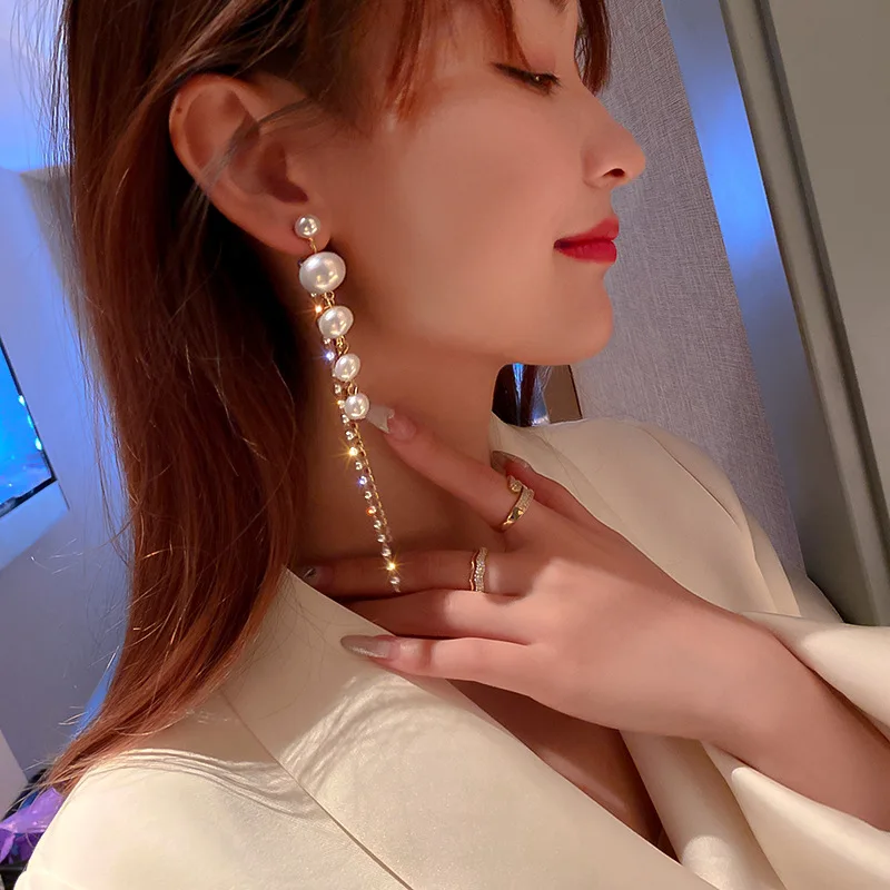 

Diamond-studded pearl tassel earrings European and American personality long earrings net red fashion temperament earrings women