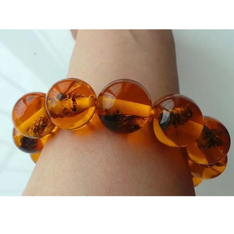 

Unusual tribal amber beads inlay insects bracelet