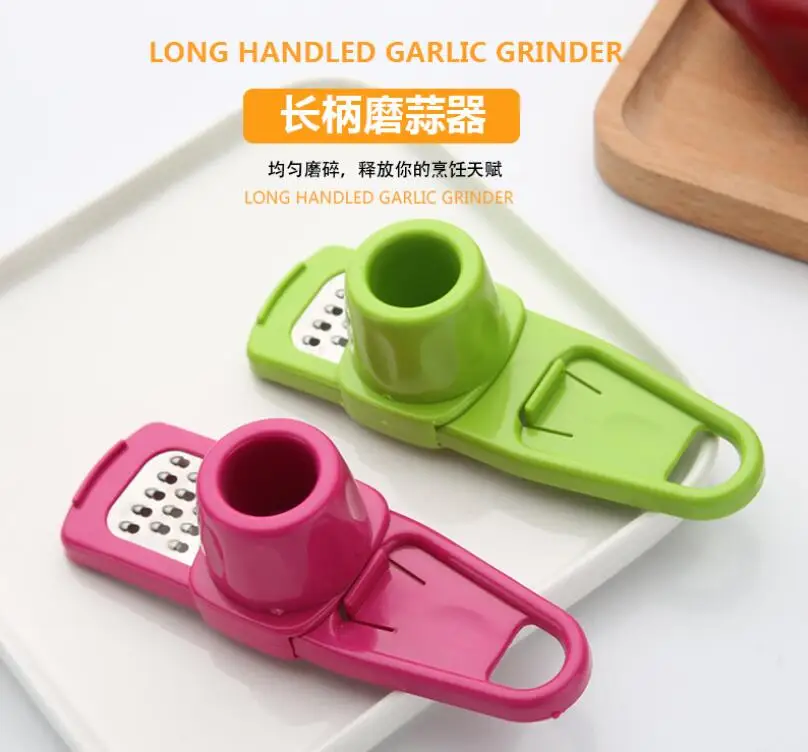 

garlic grinder Multifunctional household plastic garlic grinders Creative stainless steel manual grinding ginger