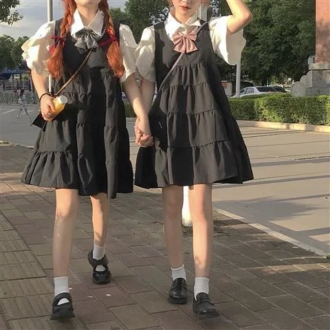 

Summer new college style age reduction cute strap dress one piece suit of loose mid long suspender skirt for female students