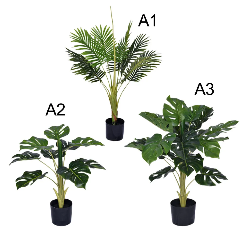 Зеленые растения искусственные пальмы деревья украшенные современным подарком