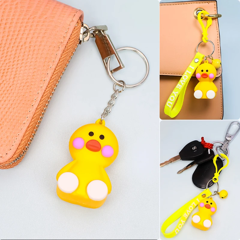 

Cute sitting cartoon little yellow duck key chain pendant soft rubber strip alloy small bell accessories small animal keychain