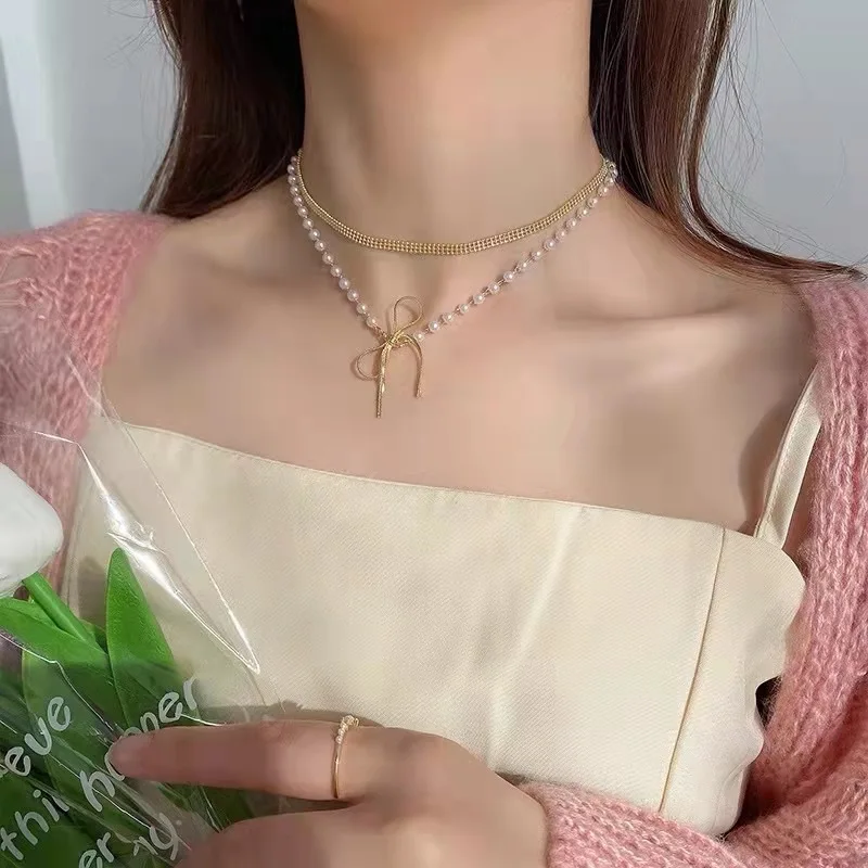 

Korean net red new freshwater pearl necklace retro multilayer temperament clavicle chain plated platinum zircon free shipping