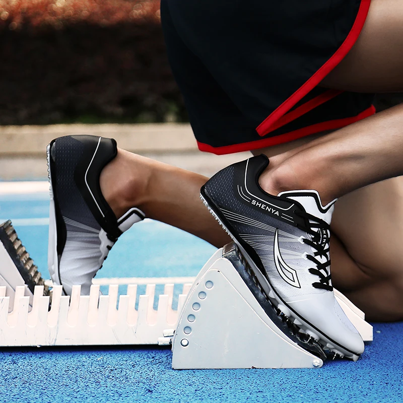 

New men and women track and field shoes running spikes orange green male shoes exam training sports running nail shoes
