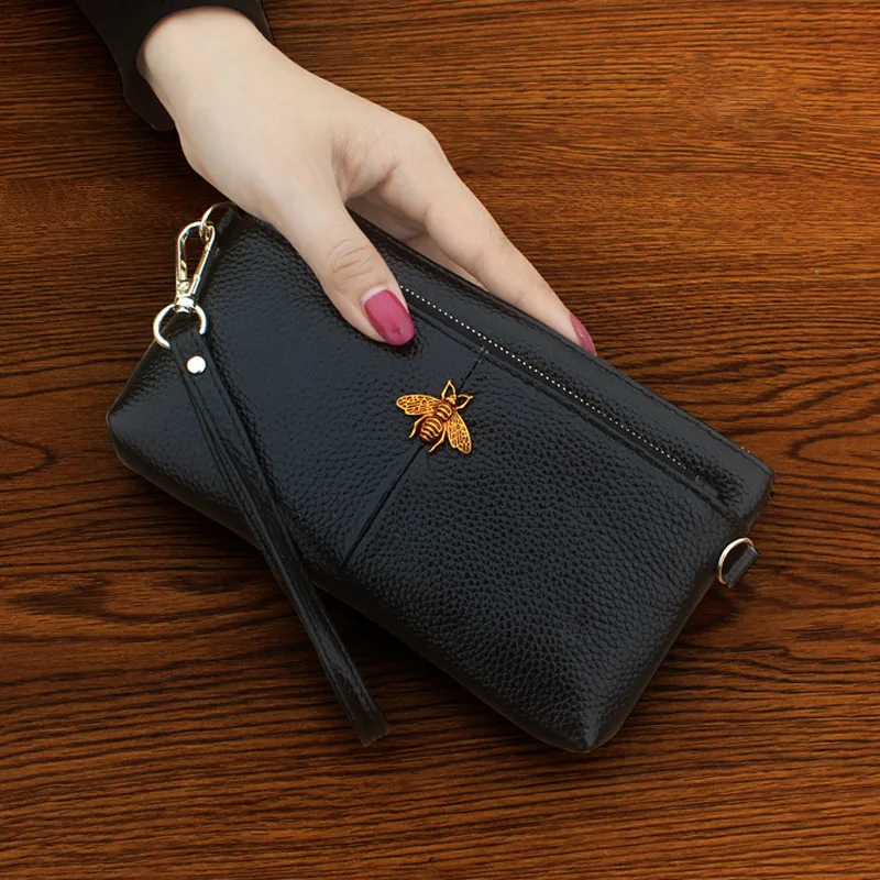 

2021 new clutch ladies head layer leather fashion coin bag Europe and the United States simple mobile phone bag wallet