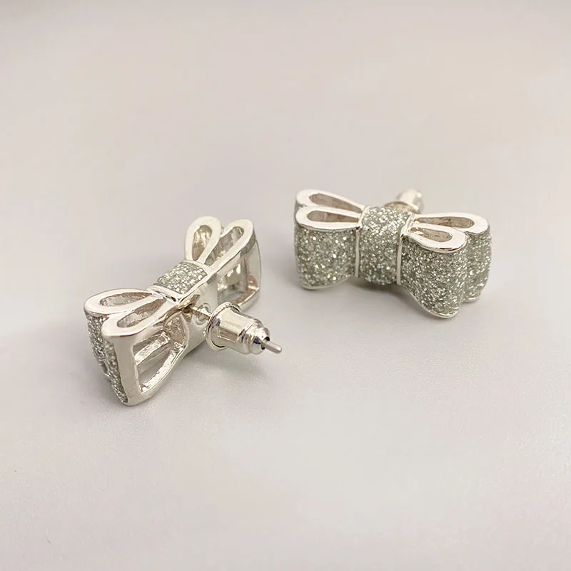 

Japanese and Korean new fashion platinum earrings femaleenamel glaze personalized bow-shaped earrings