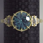 Женское металлическое кольцо в форме часов с синим кристаллом