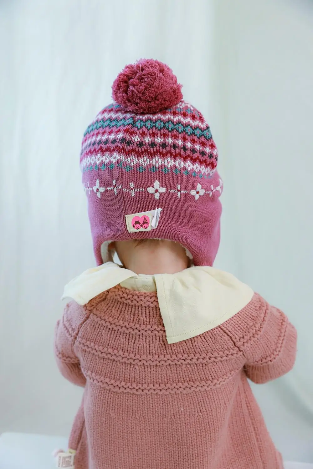 Теплая вязаная шапка ушанка для девочек с флисовой подкладкой из жаккардовой