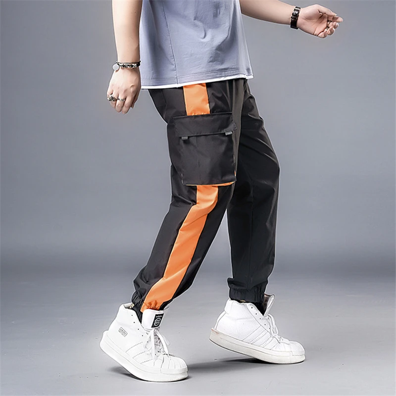 Оранжевые штаны с боковыми полосками пэчворк уличная одежда брюки-карго мужские