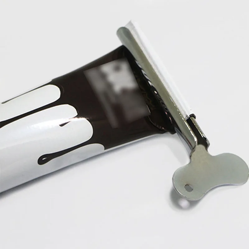 Специальный инструмент для выдавливания пасты парикмахерских горячего