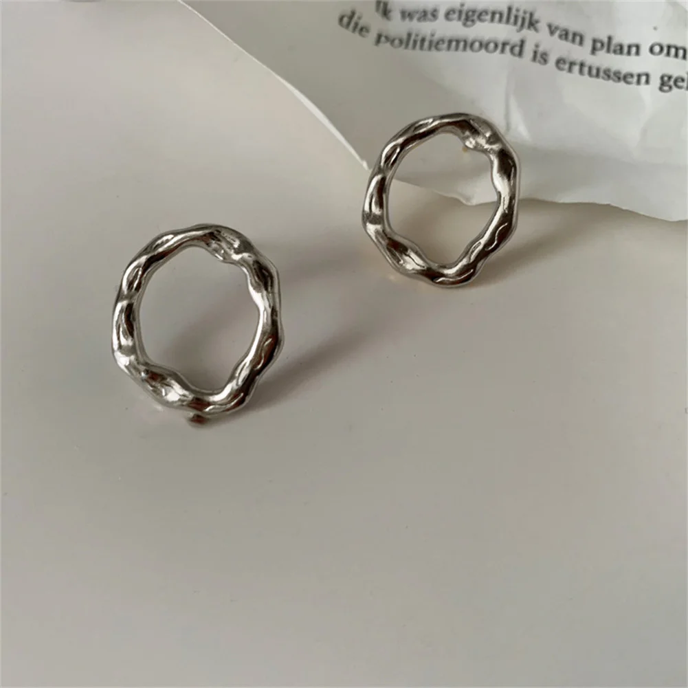 

Female Fashion French Retro Light Luxury Smooth Unique DesignSilver Irregular Hollow Round Stud Earrings Wholesale