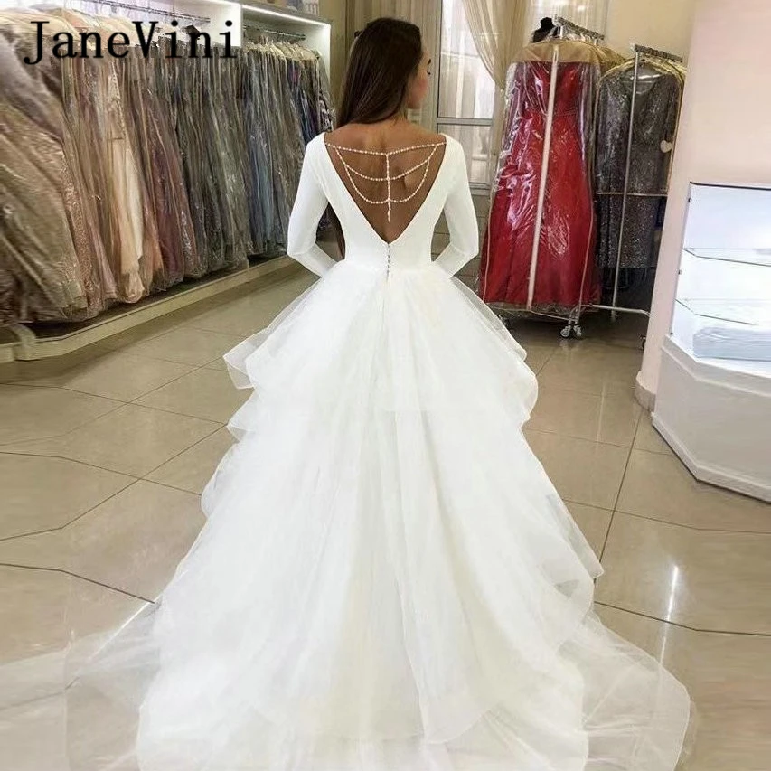 

JaneVini 2020 Sexy White Ball Gown Ruffles Wedding Dresses Deep V Neck Long Sleeve Beaded Tulle Sweep Train African Bridal Gowns