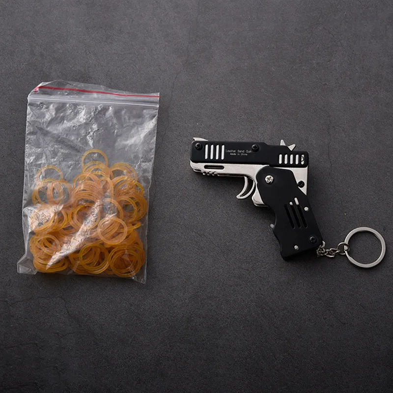 

Mini Folding Outdoor tools Can Hold The Key Chain Of The Rubber Band Gun Six Bursts Made All Metal Guns Shooting Toy Gifts Boys