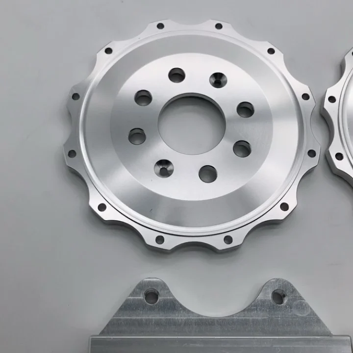 

high quantity automotive aluminum center bell and caliper bracket