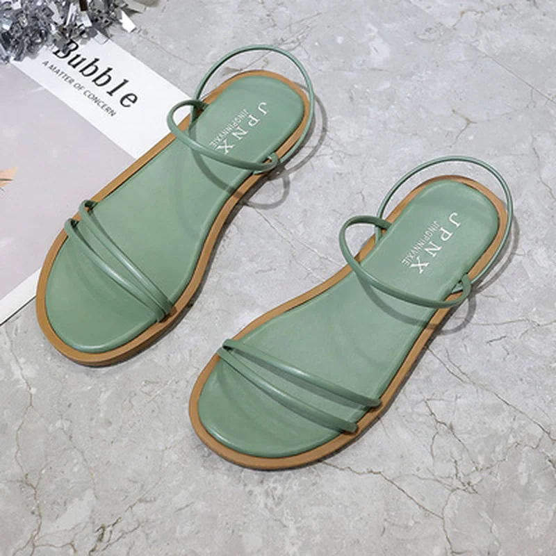 

2021 women's summer new round head joker slippers simple fairy wind trend slip comfortable flat bottom with two sandals.