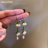 xialuoke fashion tassel bell orchids earrings for women elegant white flowers pendants pearl drop earrings wedding party jewelry