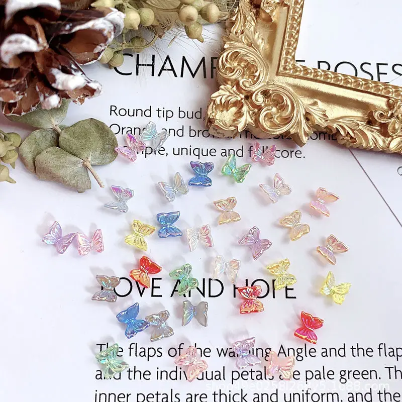 

100pcs Japanese manicure butterfly resin 3D Aurora magic color little butterfly ice transparent crystal nails art decoration