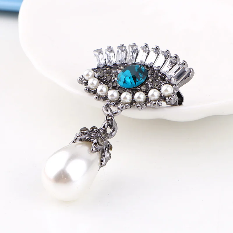 Женская брошка TODOX из сплава золота и цинка с кристаллами в виде птиц-пауков |