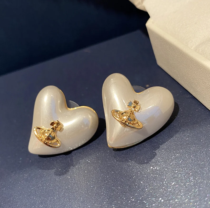 

Love heart-shaped pearl stud earrings planet personality peach heart exquisite women punk new cool piercing
