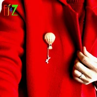 f j4z new hot air balloon brooch for women golden alloy human figure charms pins female accessories for scarf dropship
