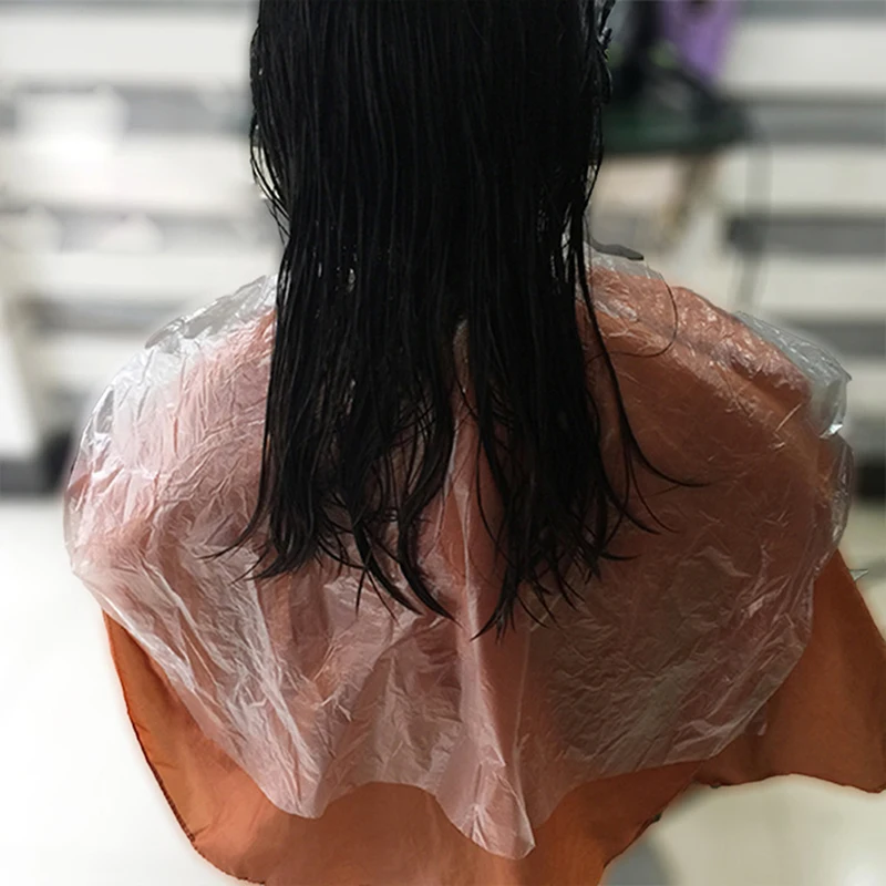 

200Pcs Disposable Hairdressing Capes PE Waterproof Apron Cutting Perm Dye Hair Cape Barber Transparent Hairdressing Cloth