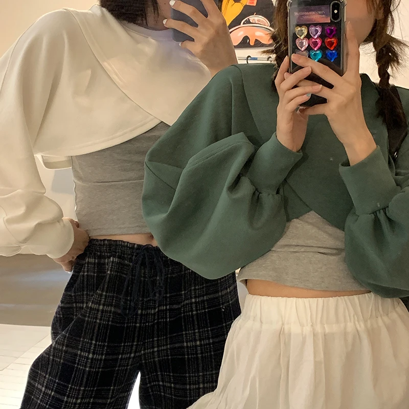 

Fashionable Design Irregular Short Sleeved Women's Sweater Looks Thin and Tall Lady Tops